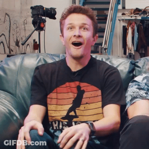 Man On Couch Wearing Shirt Saying This Is GIF