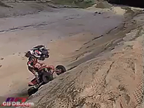 Man On Dirt Bike Doing Trick On Hill GIF