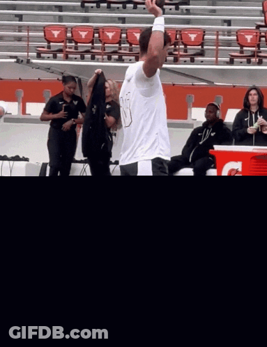 Man On Football Field With Gatorade Cooler GIF