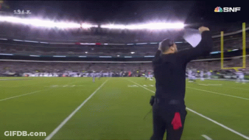 Man On Football Field With SNF Logo GIF