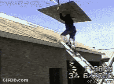 Man On Ladder Carrying Wood On Building GIF