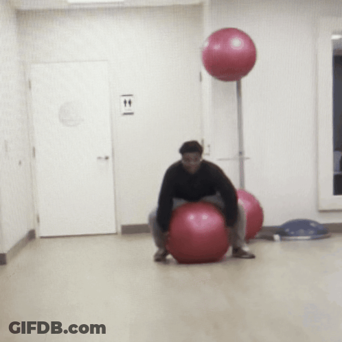 Man On Pink Exercise Ball By T & T Sign GIF