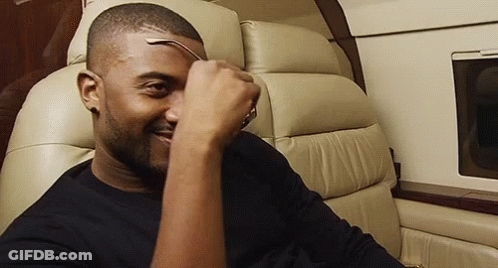 Man On Plane Holding Glasses GIF