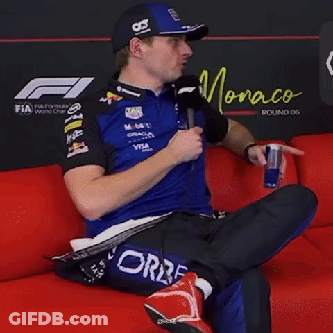 Man On Red Couch Holding Red Bull And Microphone Saying You Wait One Second GIF