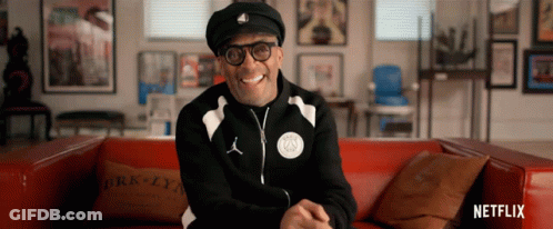 Man On Red Couch With Brooklyn Pillow GIF