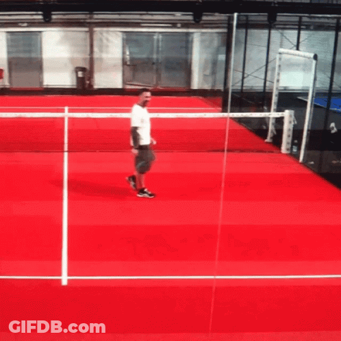 Man On Red Tennis Court Holding Racket GIF