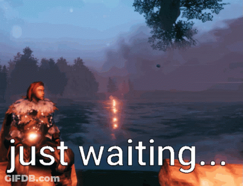 Man On Rock By Water Saying Just Waiting GIF