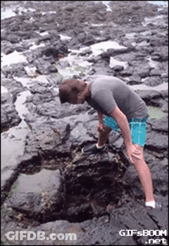 Man On Rocky Beach GIF