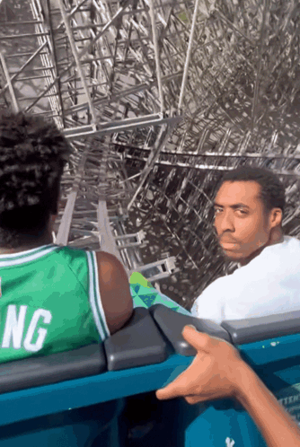 Man On Roller Coaster Wearing Green Jersey GIF