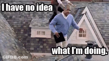 Man On Roof Holding Book And Tablet GIF