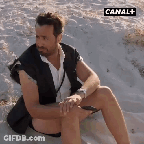 Man On Sandy Beach With Canal + GIF
