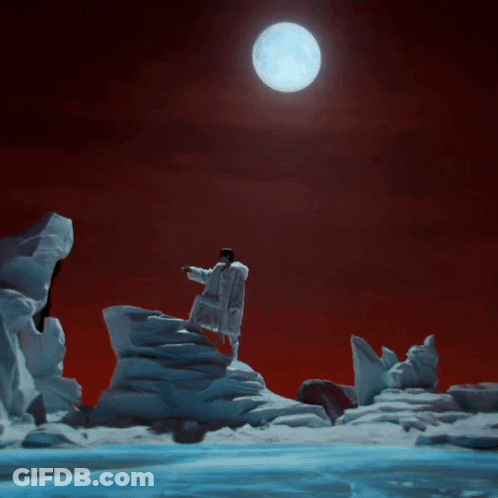 Man On Snow-Covered Mountain With Full Moon GIF