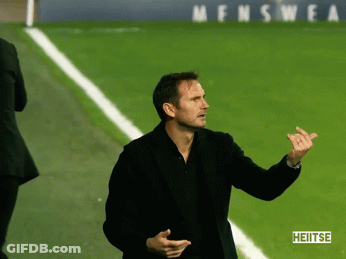 Man On Soccer Field Holding Hublot Sign GIF