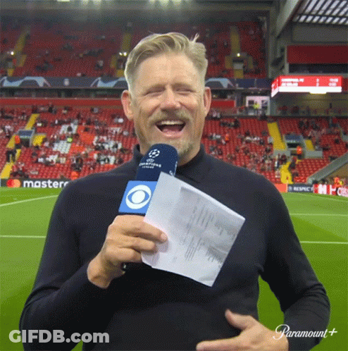 Man On Soccer Field Holding Microphone GIF