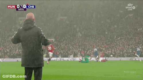 Man On Soccer Field In Front Of Crowd Watching Sky Sport Live GIF