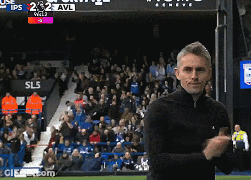 Man On Soccer Field In Front Of Scoreboard Saying SL5 GIF