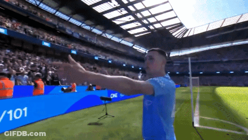Man On Soccer Field In Front Of Sign Saying 7 101 GIF