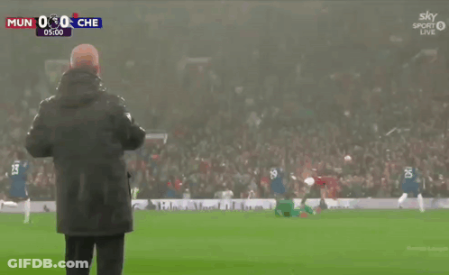 Man On Soccer Field Watching MUN Vs CHE GIF