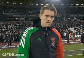 Man On Soccer Field Wearing Arsenal Jacket GIF