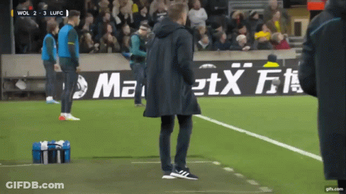 Man On Soccer Field With Maxi Advertisement GIF