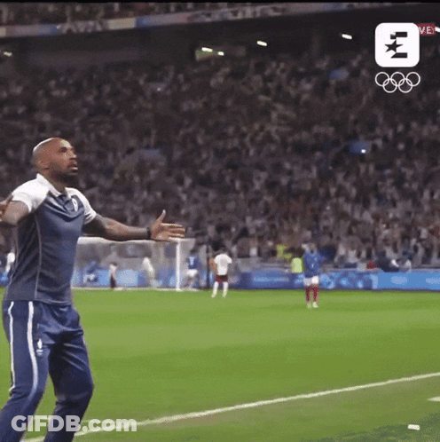 Man On Soccer Field With Olympic Logo GIF