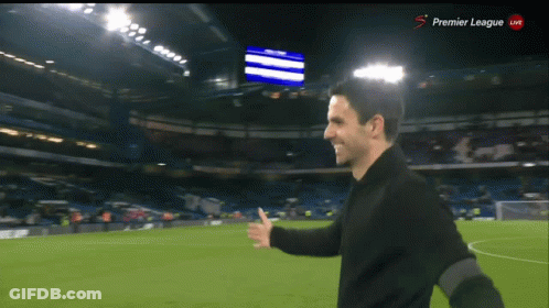 Man On Soccer Field With Premier League Screen GIF