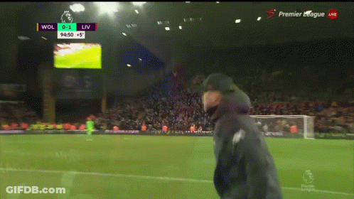 Man On Soccer Field With Scoreboard Wol 0-1 Liv GIF