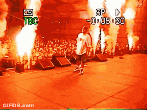Man On Stage Before Crowd With TBC And SP GIF