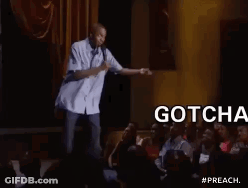 Man On Stage Holding Microphone Addressing Crowd GIF