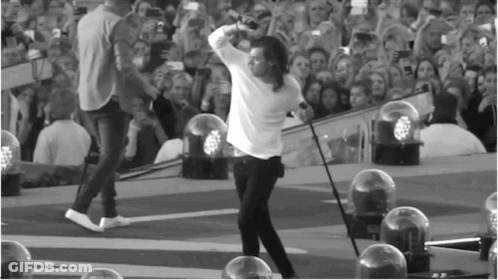 Man On Stage Holding Microphone GIF