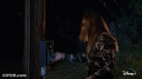 Man On Stage In Front Of Camp Shaky Lake Sign GIF