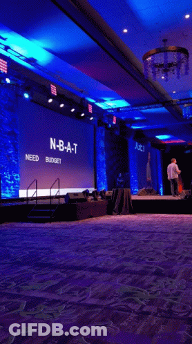 Man On Stage In Front Of NBA T Need Budget Screen GIF