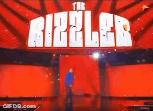 Man On Stage In Front Of Red Ripple Sign GIF