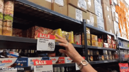 Man On Stage With Arms Outstretched And Crowd GIF