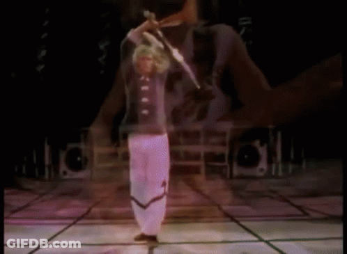 Man On Stage With Arms Outstretched Before Crowd GIF