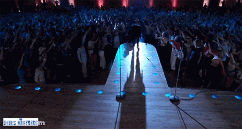 Man On Stage With Blues Brothers Sign GIF