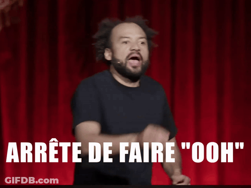 Man On Stage With Fist In Air Saying Arrête De Faire Ooh GIF