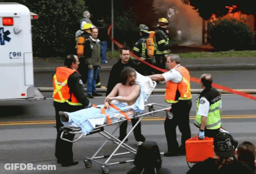 Man On Stretcher Loaded Into Ambulance 9H GIF