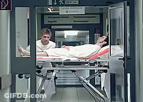 Man On Stretcher With Lynx Ambulance Sign GIF