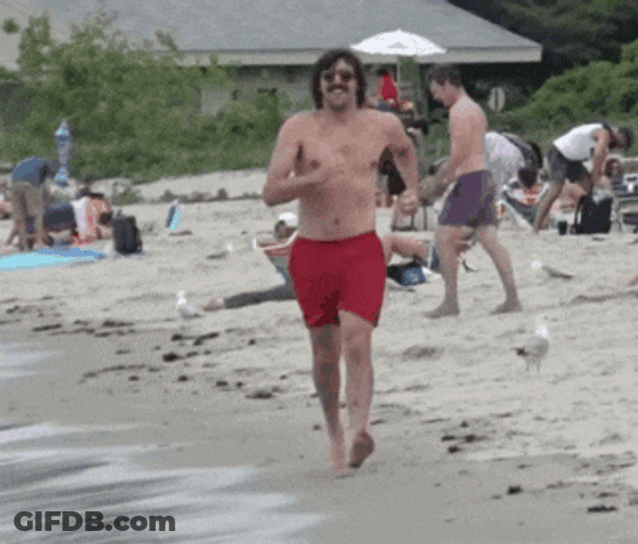 Man On The Beach Power Walking GIF