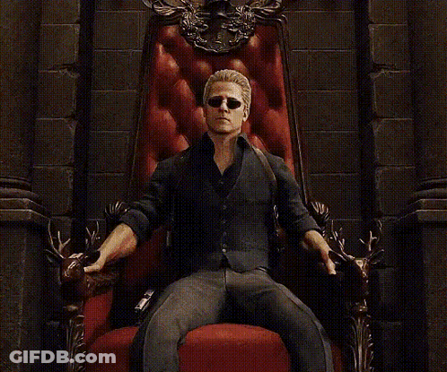 Man On Throne With Coat Of Arms Saying King GIF