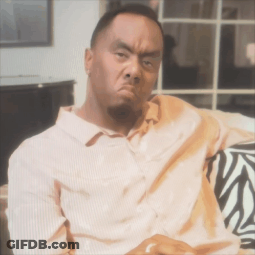 Man On Zebra Print Couch Making Funny Face GIF