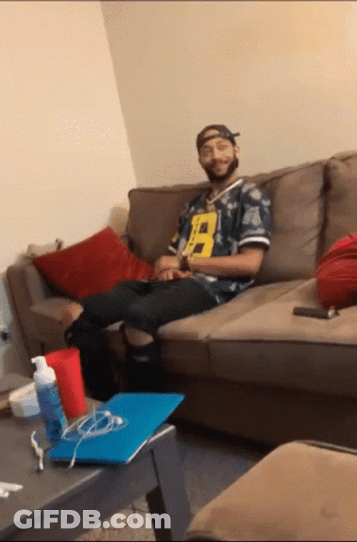 Man Oop Reaction While Seating On The Couch GIF