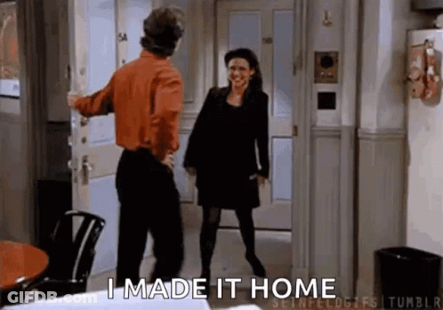 Man Opening Door For Woman In Hallway GIF
