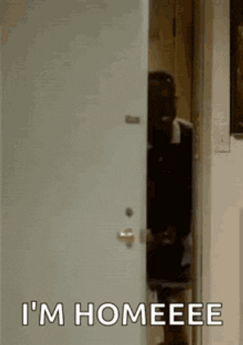 Man Opening Door Saying I'm Home GIF