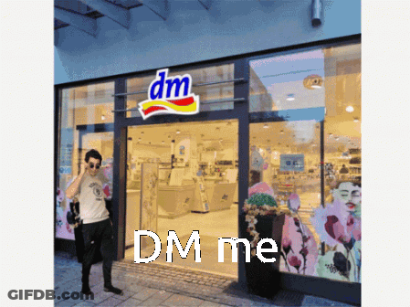 Man Outside DM Store Talking On Cell Phone GIF