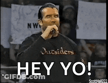Man Outsiders Shirt Holding Mic Saying Hey Yo GIF