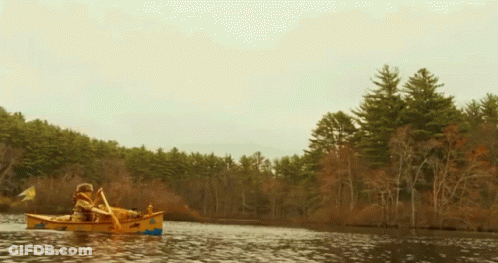 Man Paddling Yellow Canoe GIF