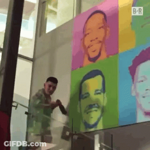 Man Painting Colorful Portrait On Wall GIF