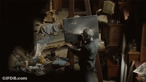 Man Painting On Canvas In Dark Room GIF